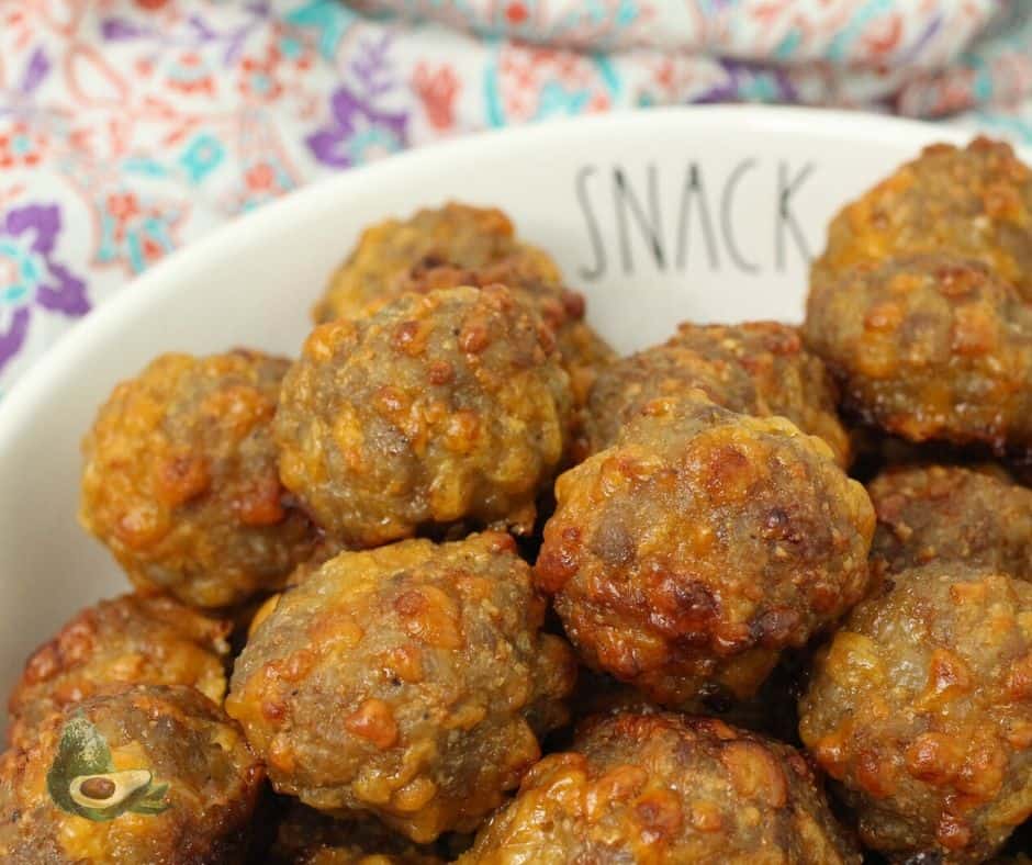 close up bowl of sausage balls with colorful napkin