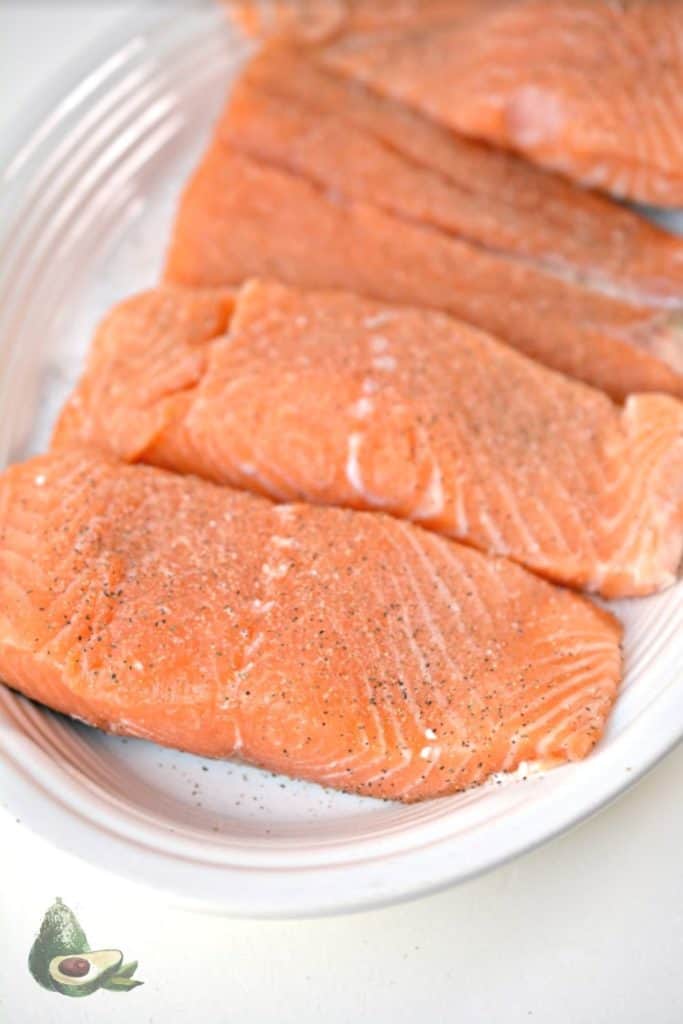 salmon filets on a white plate